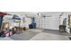 Garage with tiled floor and storage at 4332 Lamson Ave, Spring Hill, FL 34608