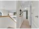 Upstairs hallway with a view of the landing and green accent wall at 4332 Lamson Ave, Spring Hill, FL 34608