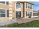 Elegant front entrance with dark-gray door and decorative stone pathway at 4332 Lamson Ave, Spring Hill, FL 34608