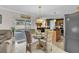 Kitchen features an island, dining area, and sliding doors to the pool at 4332 Lamson Ave, Spring Hill, FL 34608