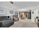 Comfortable living area showcasing a view of the kitchen and access to backyard at 4332 Lamson Ave, Spring Hill, FL 34608