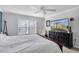 Main bedroom with large bed and dresser, and window at 4332 Lamson Ave, Spring Hill, FL 34608