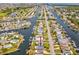Aerial view highlighting home's canal-front location and neighborhood at 4430 Floramar Ter, New Port Richey, FL 34652