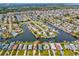 Wide aerial showcasing waterfront home's location in a canal community at 4430 Floramar Ter, New Port Richey, FL 34652