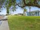 Large grassy backyard overlooking the water at 4430 Floramar Ter, New Port Richey, FL 34652
