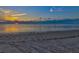 Scenic sunset view with tire tracks on a sandy beach at 4430 Floramar Ter, New Port Richey, FL 34652