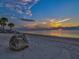 Stunning sunset over calm waters on a sandy beach at 4430 Floramar Ter, New Port Richey, FL 34652