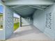 Covered carport with concrete slab and decorative blocks at 4430 Floramar Ter, New Port Richey, FL 34652