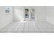 Bright dining room with white tile flooring and french doors at 4430 Floramar Ter, New Port Richey, FL 34652