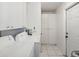 Laundry room with washer, dryer, and storage cabinets at 4430 Floramar Ter, New Port Richey, FL 34652