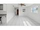 Bright living room with tile flooring, and lots of natural light at 4430 Floramar Ter, New Port Richey, FL 34652