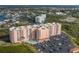Aerial view of a condo building with pool and parking lot at 4516 Seagull Dr # 417, New Port Richey, FL 34652