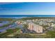 Aerial view showing building, boat lift, and waterfront at 4516 Seagull Dr # 417, New Port Richey, FL 34652