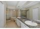 Bathroom with granite countertops, double sinks, and a large walk-in shower at 4516 Seagull Dr # 417, New Port Richey, FL 34652