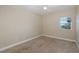 Bright bedroom with carpeted floor and a window with a view at 4516 Seagull Dr # 417, New Port Richey, FL 34652