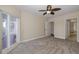 Spacious bedroom with carpeting, a ceiling fan and access to bathroom at 4516 Seagull Dr # 417, New Port Richey, FL 34652