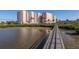 Wooden boardwalk leading to waterfront condo building at 4516 Seagull Dr # 417, New Port Richey, FL 34652