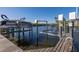 Private boat lift with wooden dock and waterfront access at 4516 Seagull Dr # 417, New Port Richey, FL 34652