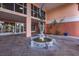 Courtyard with a beautiful dolphin fountain, lush landscaping and seating at 4516 Seagull Dr # 417, New Port Richey, FL 34652