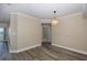 Open dining area with wood-look floors, leading to another room at 4516 Seagull Dr # 417, New Port Richey, FL 34652