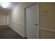 Clean hallway with carpet and access to storage at 4516 Seagull Dr # 417, New Port Richey, FL 34652