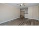 Living room with wood-look floors and access to kitchen at 4516 Seagull Dr # 417, New Port Richey, FL 34652