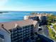 Aerial view of waterfront condo building and surrounding area at 4620 Bay Blvd # 1158, Port Richey, FL 34668