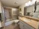 Clean bathroom with tub, shower, and granite vanity at 4620 Bay Blvd # 1158, Port Richey, FL 34668