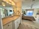 Bathroom with vanity and view into bedroom at 4620 Bay Blvd # 1158, Port Richey, FL 34668