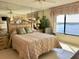 Comfortable bedroom with water views and dresser at 4620 Bay Blvd # 1158, Port Richey, FL 34668