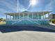Community center with light teal exterior and white columns at 4620 Bay Blvd # 1158, Port Richey, FL 34668