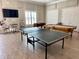 Community game room with ping pong, foosball, and pool tables at 4620 Bay Blvd # 1158, Port Richey, FL 34668