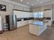 Modern kitchen in community room with stainless steel appliances at 4620 Bay Blvd # 1158, Port Richey, FL 34668