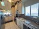 Kitchen boasts granite countertops and modern appliances with a water view at 4620 Bay Blvd # 1158, Port Richey, FL 34668
