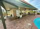 Relaxing community pool area with tables, chairs, and a covered bar at 4620 Bay Blvd # 1158, Port Richey, FL 34668