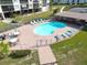 Community pool with patio furniture and seating at 4620 Bay Blvd # 1158, Port Richey, FL 34668
