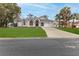 Single-story house with a 2-car garage and manicured lawn at 5083 Carnation Ct, Spring Hill, FL 34607