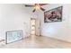 Bedroom featuring a vaulted ceiling, ceiling fan, laminate wood flooring, and view into the hallway at 5286 Hamlet Cir, Spring Hill, FL 34606