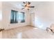 Bright bedroom with vaulted ceiling, ceiling fan, window and door with laminate wood flooring at 5286 Hamlet Cir, Spring Hill, FL 34606