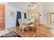 A formal dining room features elegant furniture, hardwood floors, and lots of natural light at 5286 Hamlet Cir, Spring Hill, FL 34606