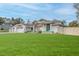 View of home's front exterior, featuring well-manicured lawn and stone accents at 5286 Hamlet Cir, Spring Hill, FL 34606