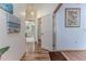Hallway showcasing hardwood floors and access to bathroom and other rooms at 5286 Hamlet Cir, Spring Hill, FL 34606