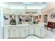 Cozy kitchen with a breakfast bar and additional seating area at 5286 Hamlet Cir, Spring Hill, FL 34606