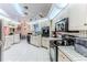 Well-equipped kitchen with stainless steel appliances and white cabinetry at 5286 Hamlet Cir, Spring Hill, FL 34606