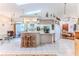 Open-concept kitchen with breakfast bar and views of the dining and living areas at 5286 Hamlet Cir, Spring Hill, FL 34606