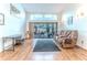 Bright living room with skylights and sliding glass doors leading to a pool area at 5286 Hamlet Cir, Spring Hill, FL 34606