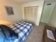 Bright bedroom featuring a double bed and built-in closet at 5434 Chad Pl # 20, New Port Richey, FL 34652