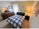 Comfortable bedroom with a double bed and dresser at 5434 Chad Pl # 20, New Port Richey, FL 34652