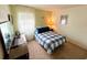Cozy bedroom with a double bed and ample closet space at 5434 Chad Pl # 20, New Port Richey, FL 34652
