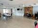 Spacious community room with tables, chairs, and a fireplace at 5434 Chad Pl # 20, New Port Richey, FL 34652